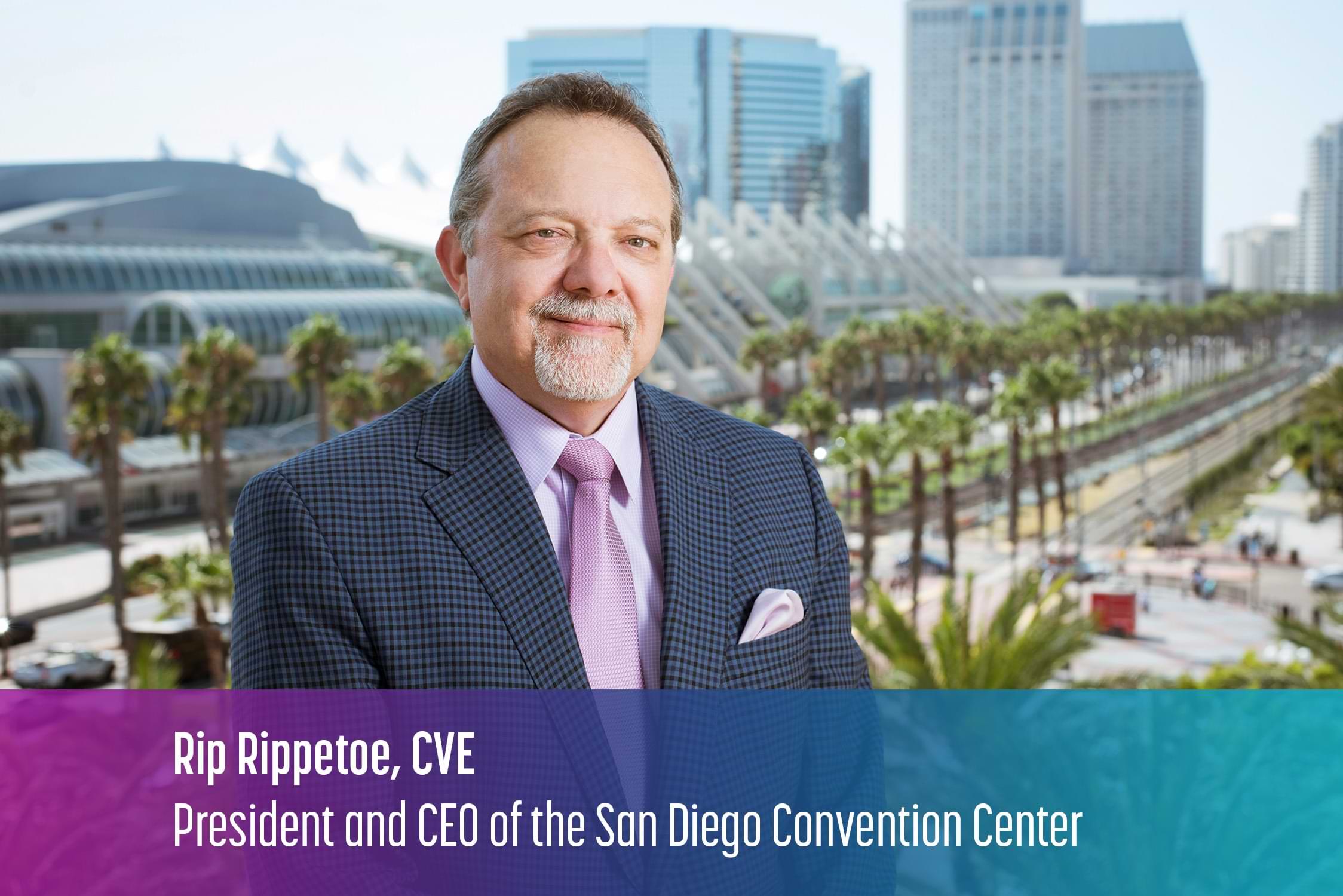 Image of Rip Rippetoe in a suit and tie with the San Diego Convention Center building behind him